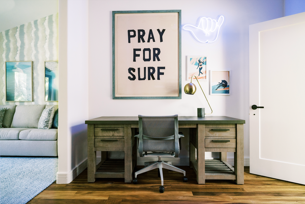 surf themed bedroom with desk and sofa