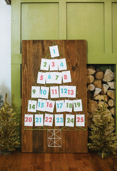 string art advent calendar on piece of wood