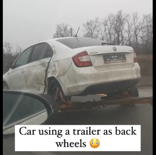car using trailer as back wheels