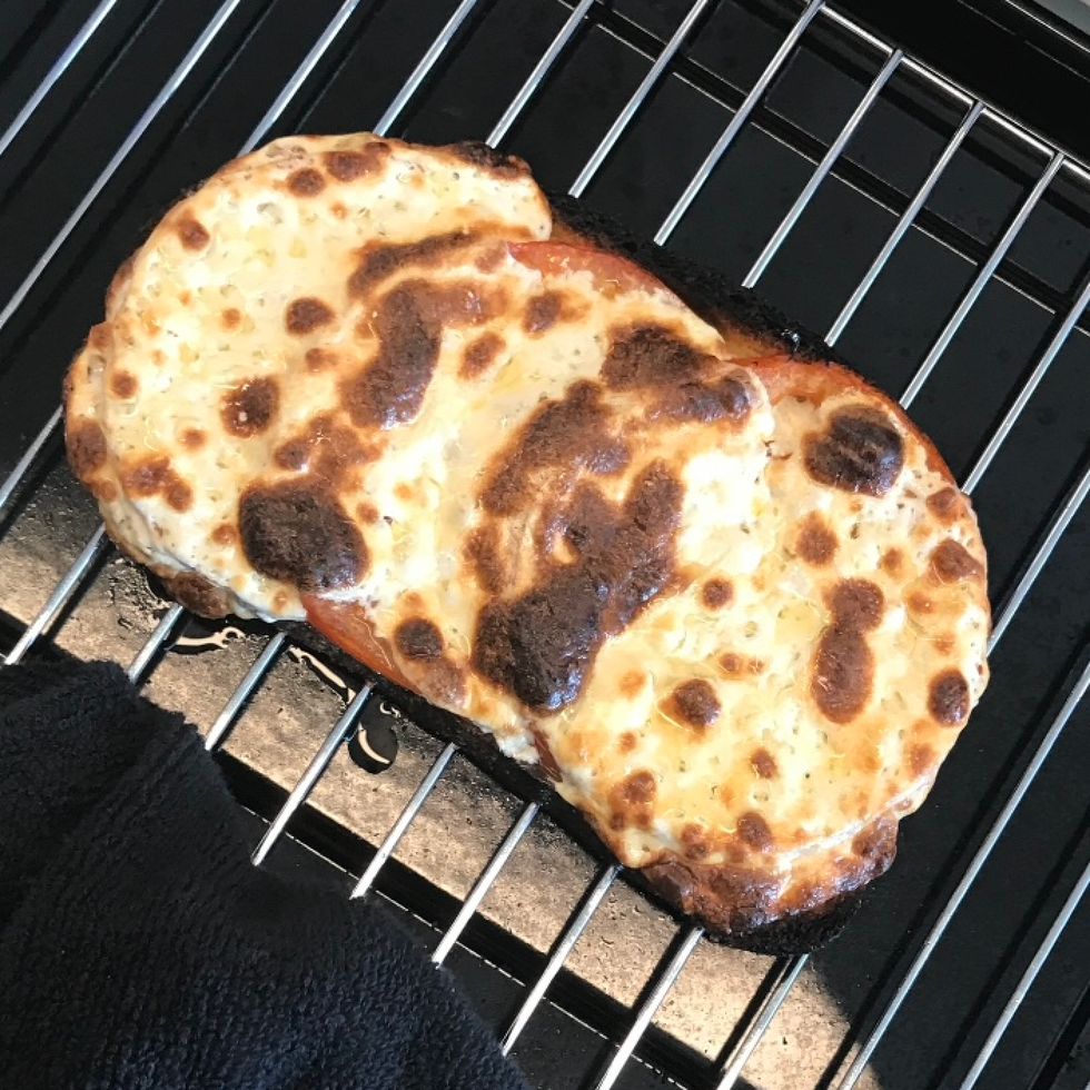 melted mozzarella cheese on toaster oven tray melted mozzarella cheese on toaster oven tray