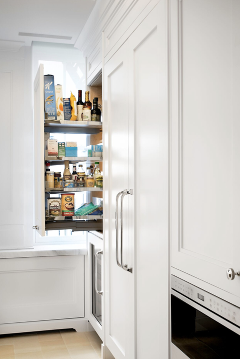 pantry organization ideas pullout pantry in the white kitchen with food on the shelves