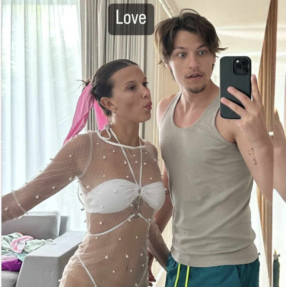 Millie Bobby Brown Gives Major Bride Vibes in a White Bikini with a Sheer Pearl Cover Up