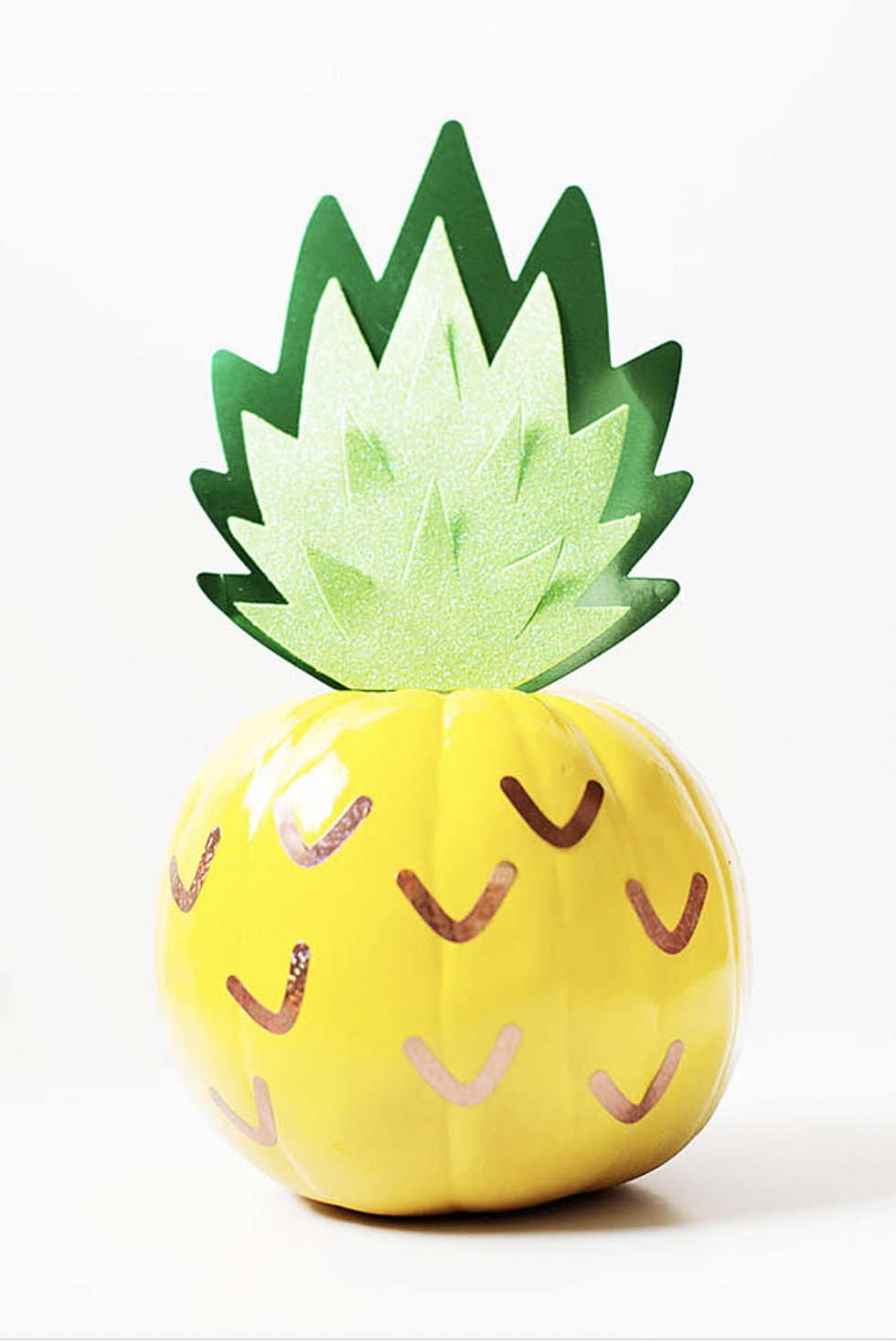 a pumpkin decorated like a pineapple