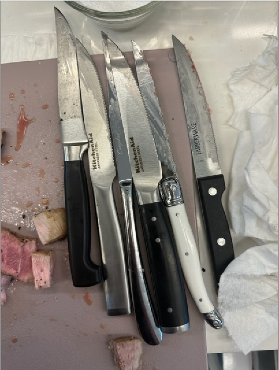 steak knife testing on board with porkchop