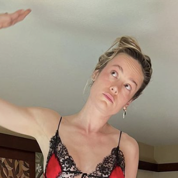 Brie Larson's Hotel Room Aesthetic? A Red Lingerie Dress with Lacy Underboob