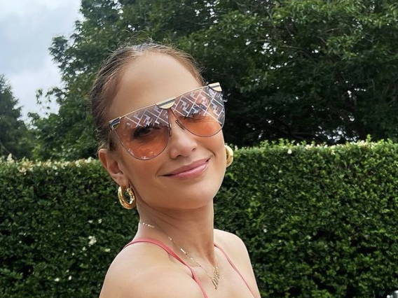 Jennifer Lopez models skimpy white Guess swimsuit in photos