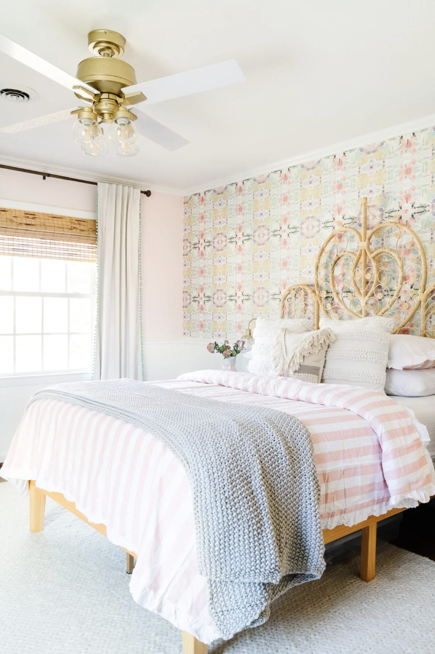 pre teen bedroom with pink and pattern accent wall