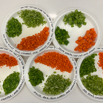 overhead shot of chopped peppers carrot and celery on labeled plates overhead shot of chopped peppers carrot and celery on labeled plates