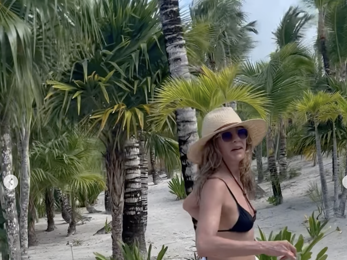 Jennifer Aniston wows in black string bikini as she strides into