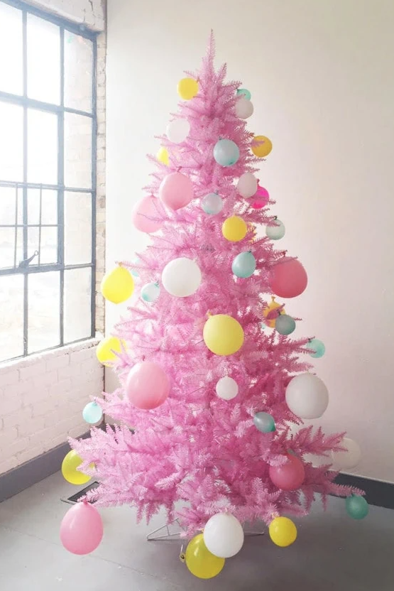 a pink tree with balloons