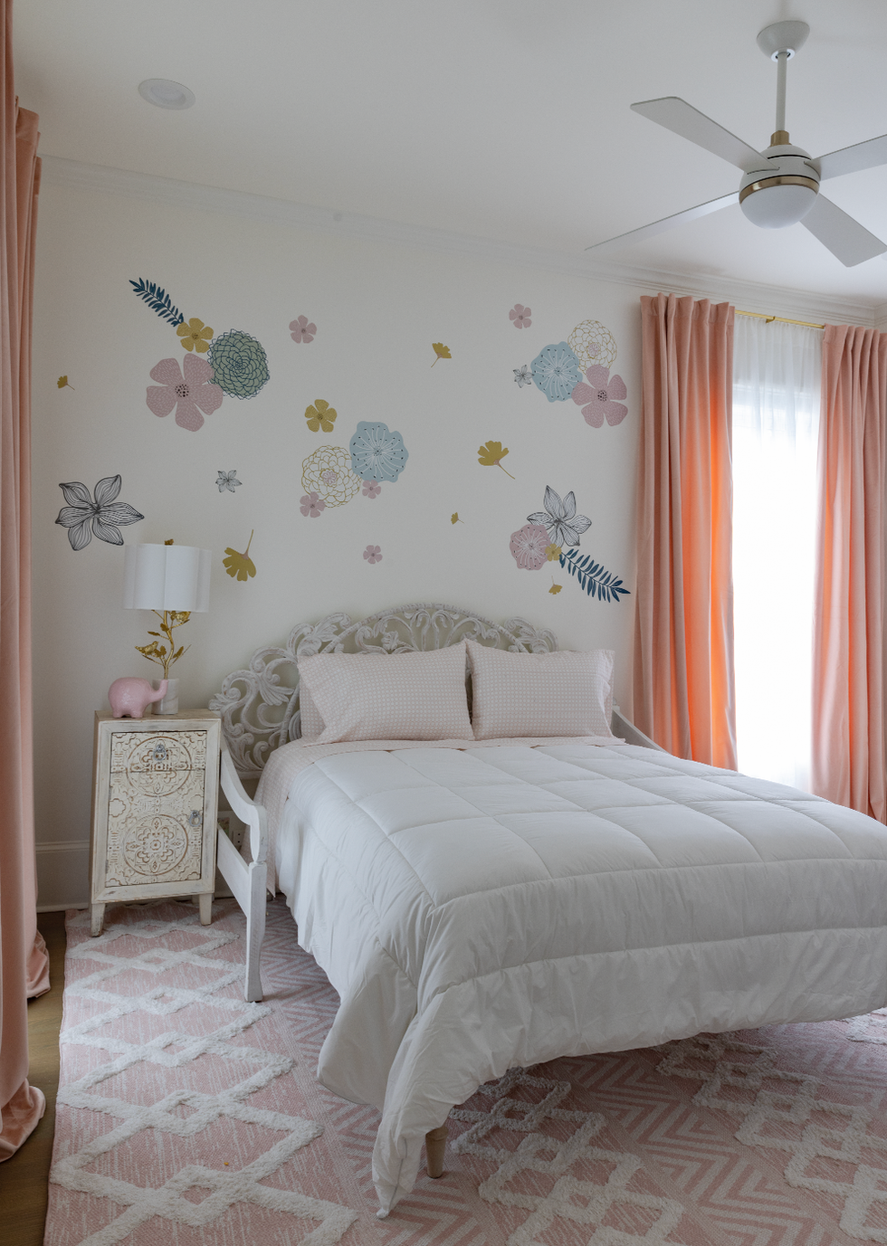 a bed with a flower pattern