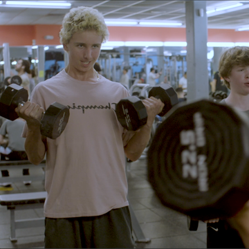a couple of men in a gym a couple of men in a gym