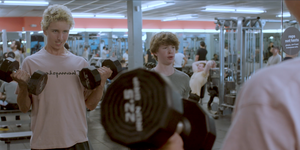 a couple of men in a gym