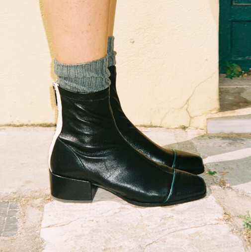 a person wearing black boots
