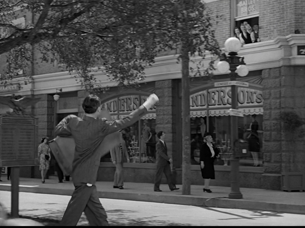 a man is holding a skateboard