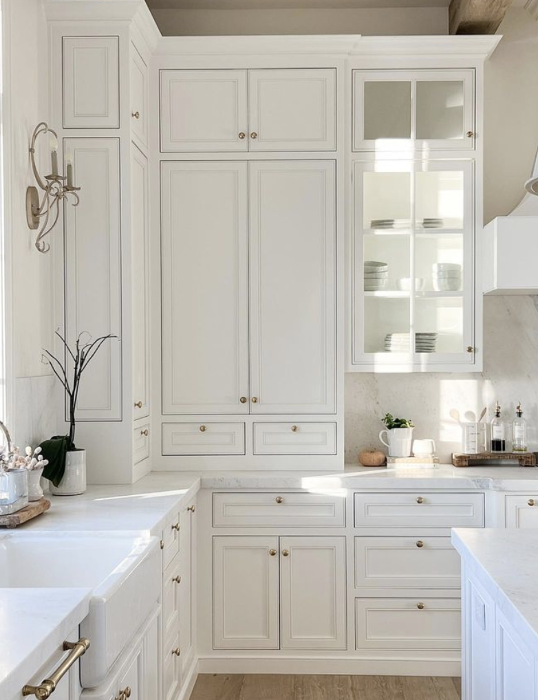 a white kitchen with white cabinets