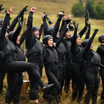 a group of people in black uniforms