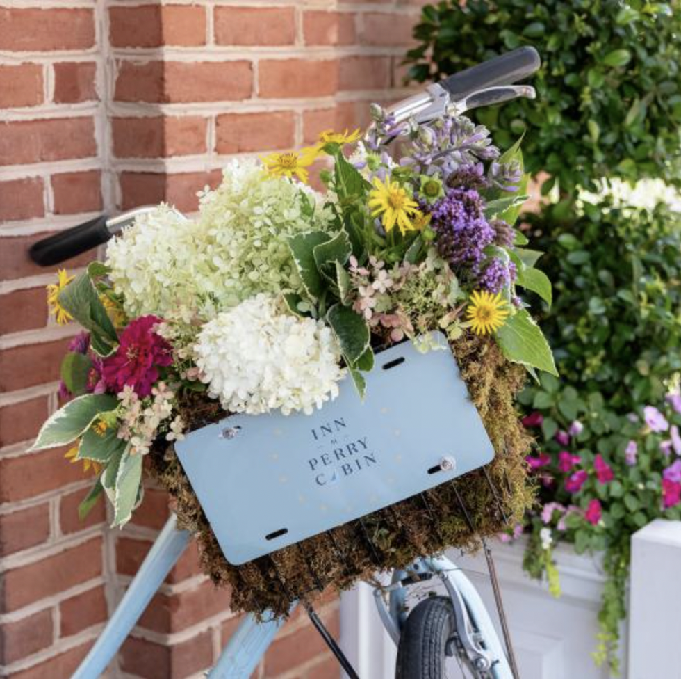 a bouquet of flowers on a bike basket