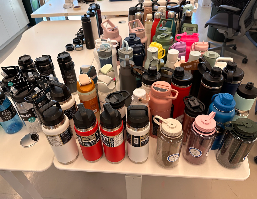 a group of water bottles on a table