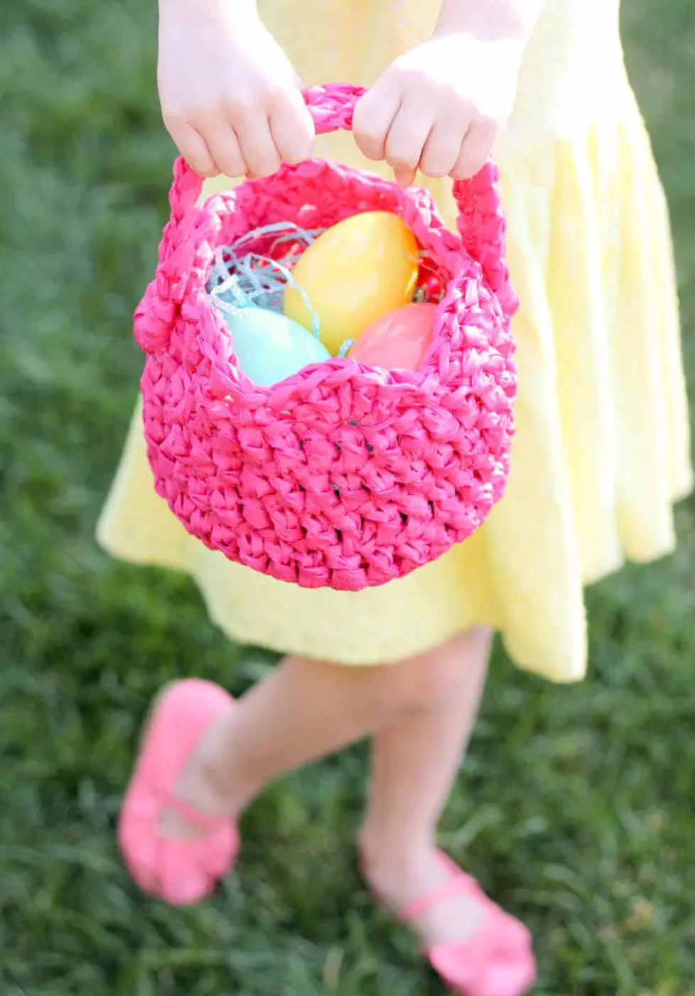 girl holding crocheted easter basket