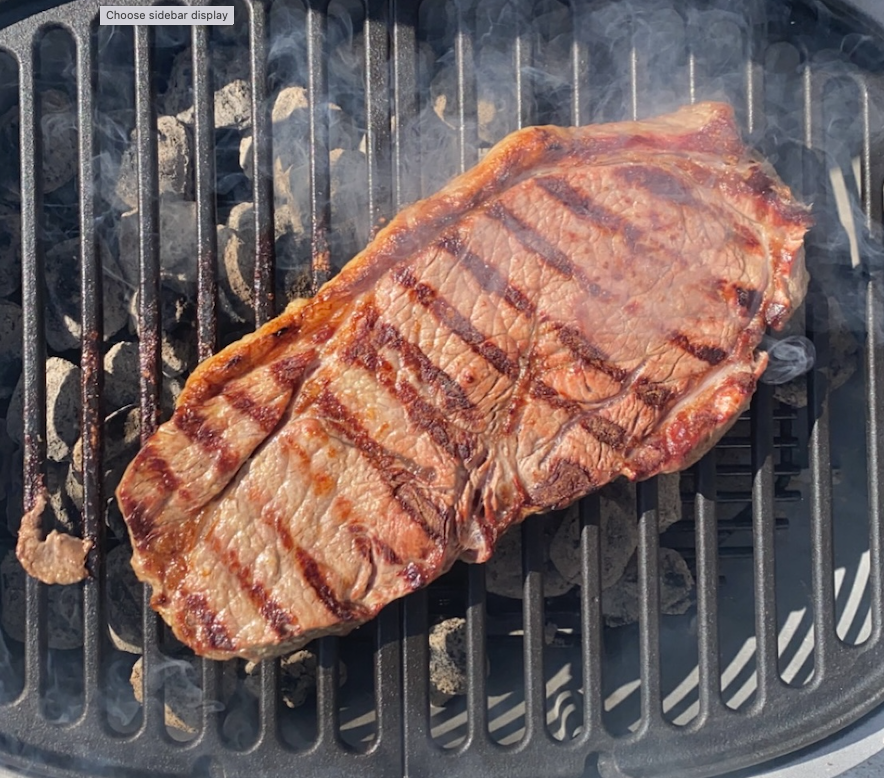 a piece of meat on a grill