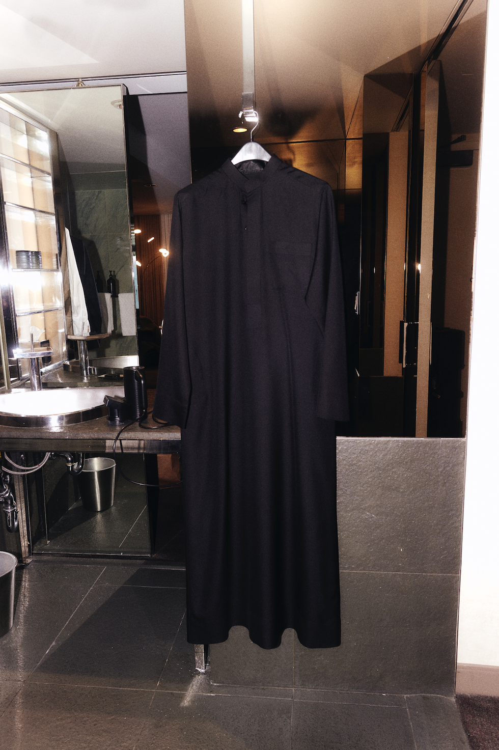 a black robe in a bathroom