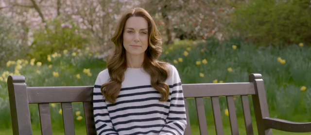 a woman sitting on a bench
