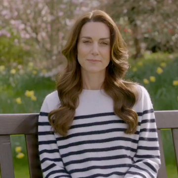 a woman sitting on a bench