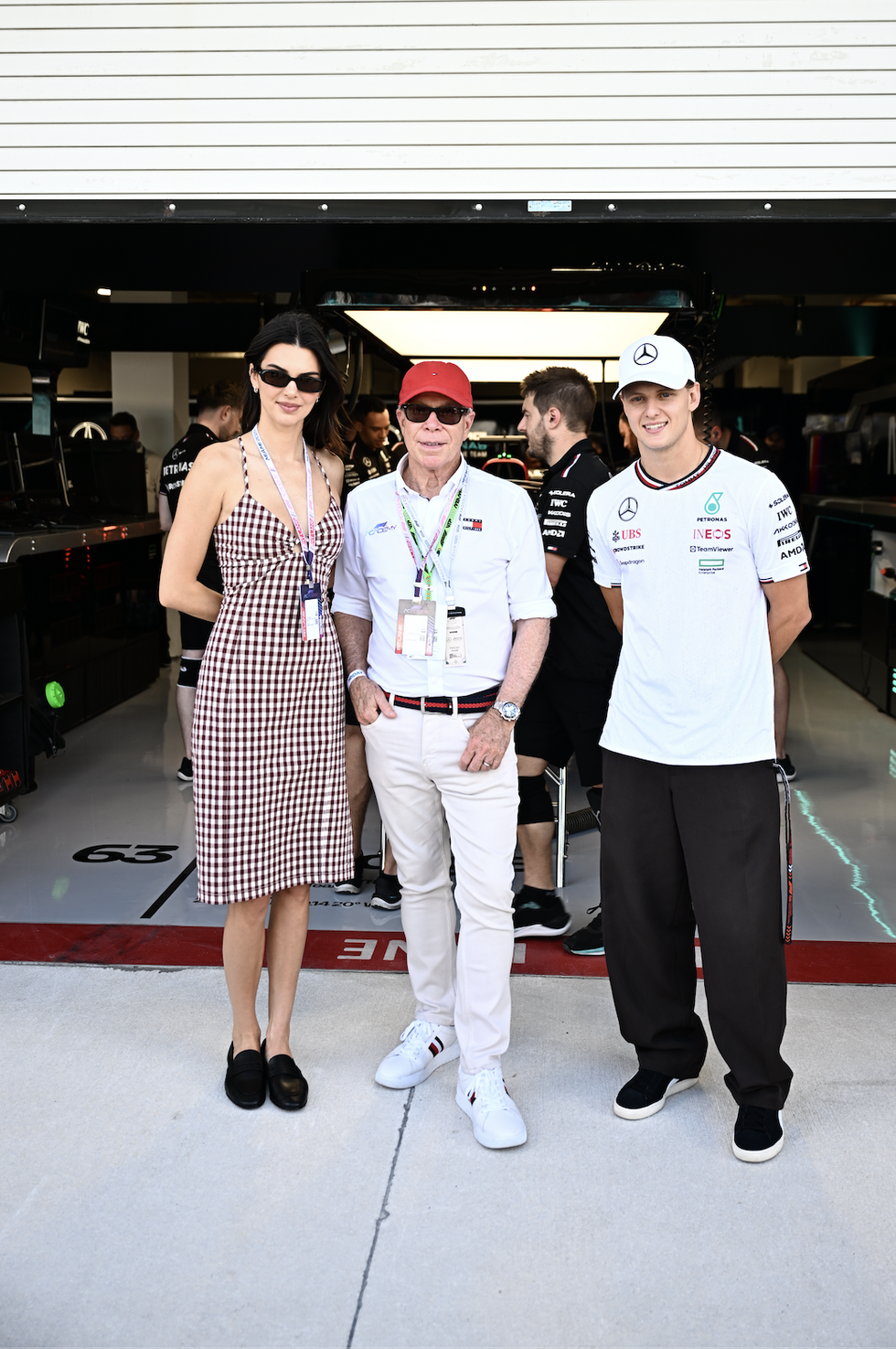 kendall jenner, tommy hilfiger and mick schumacher of germany, reserve driver of mercedes pose for a photo in the pitlane during practice prior to round 2 miami of the f1 academy at miami international autodrome on may 03, 2024 in miami, florida