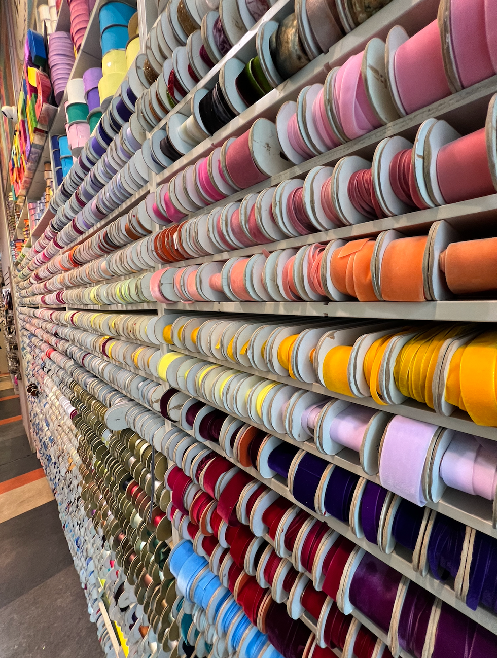 a rack of colorful ties