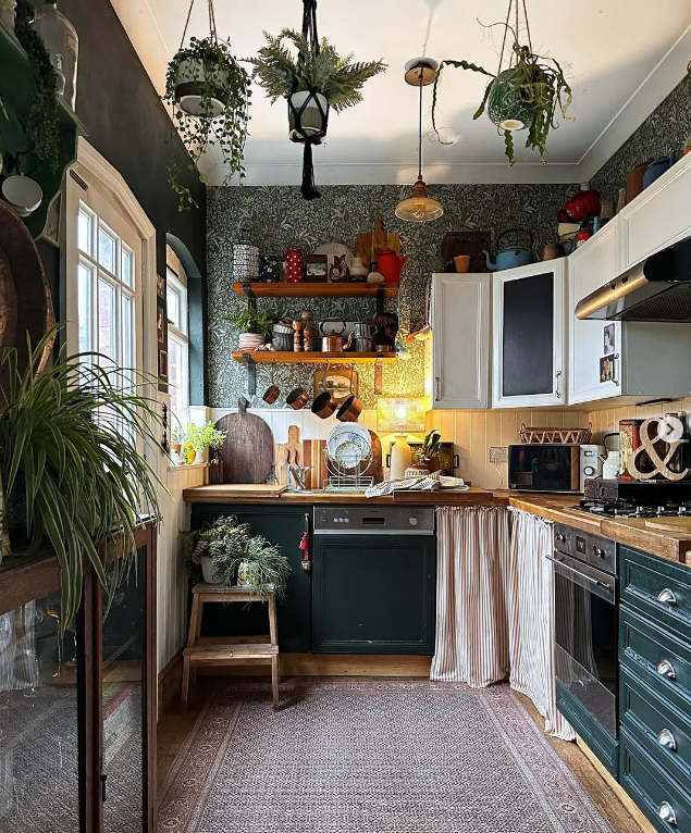 a kitchen with a chandelier and a table a kitchen with a chandelier and a table