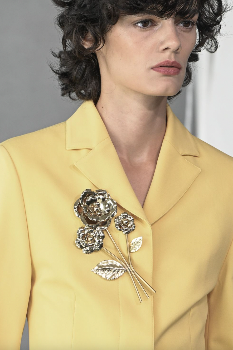 a person wearing a yellow shirt
