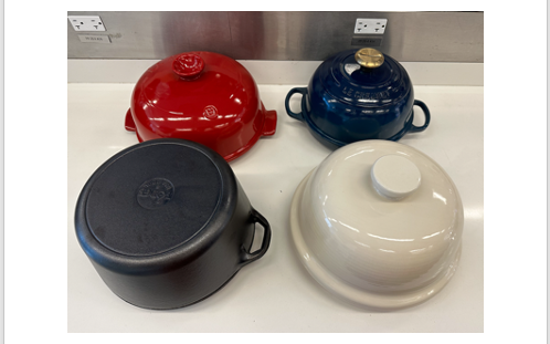 a group of four bread baking cloches during testing