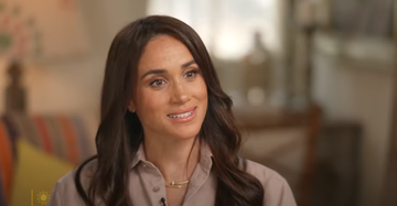 a woman smiling at the camera