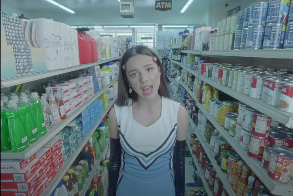 olivia rodrigo in light blue cheerleader outfit