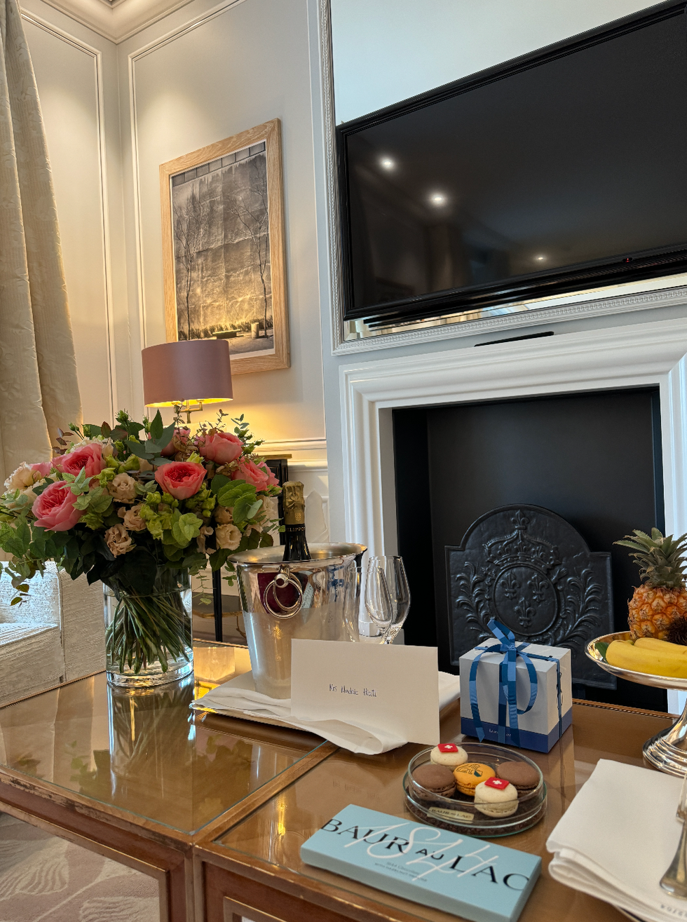 table with flowers and chocolate on it