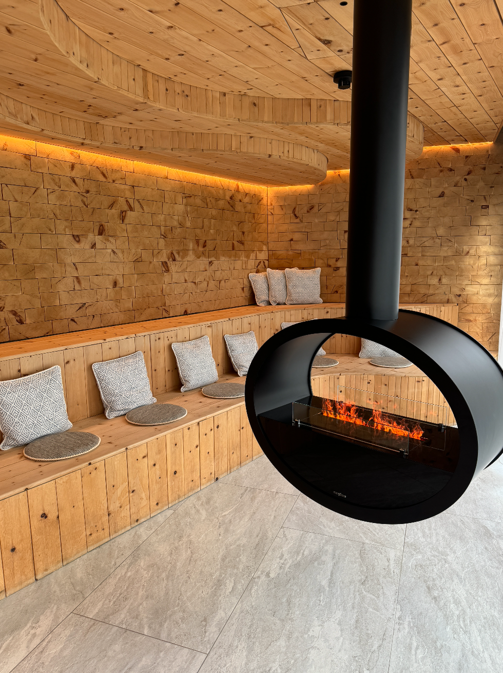 fireplace with seats behind it