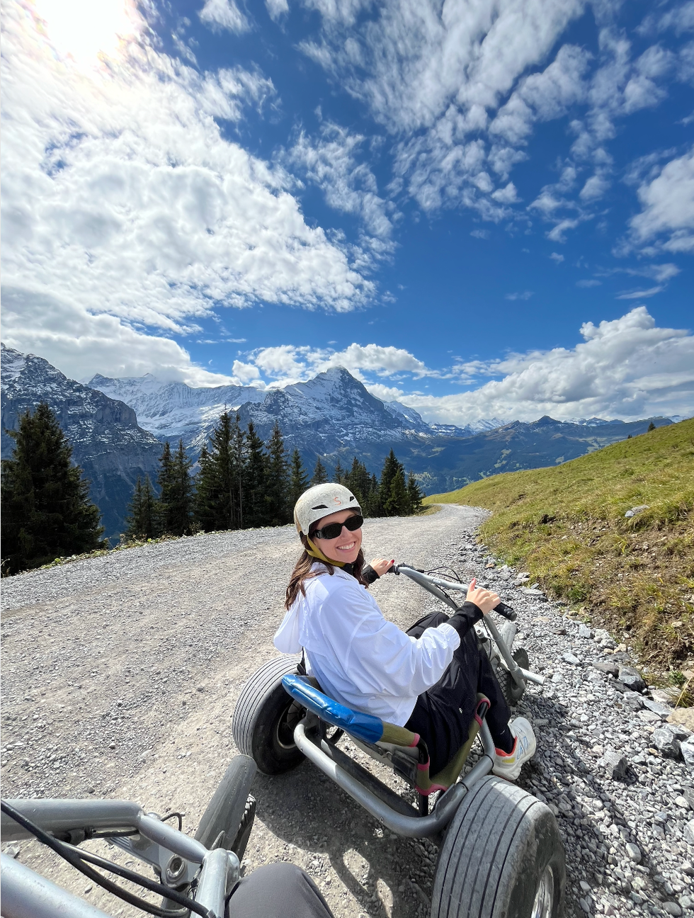 person smiling on mountain cart