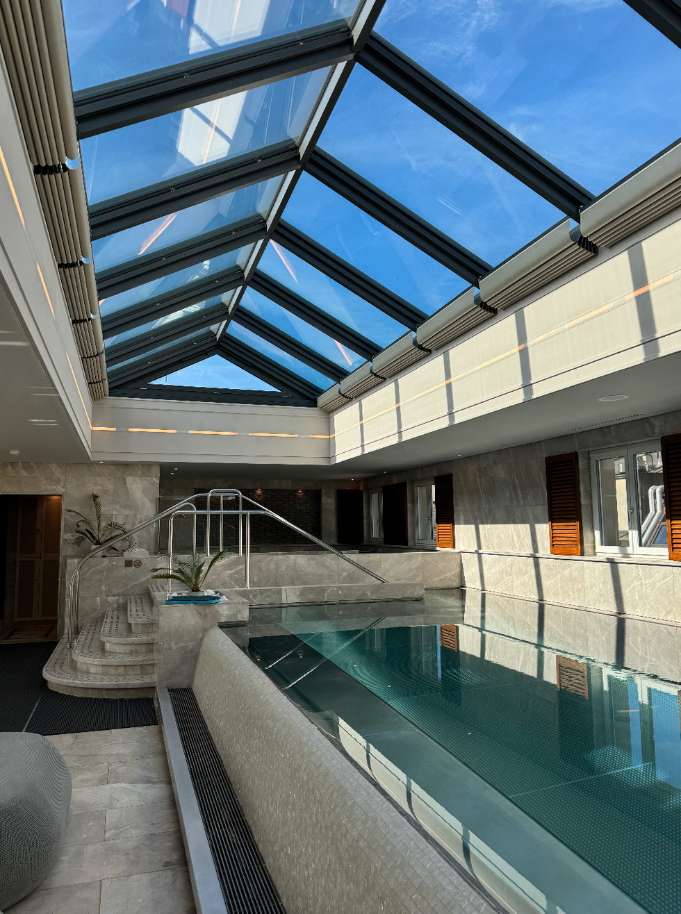 a pool with a sky light over it