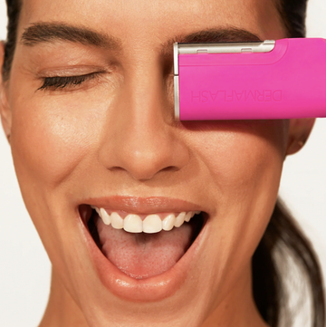 a person holding a bright pink object a person holding a bright pink object