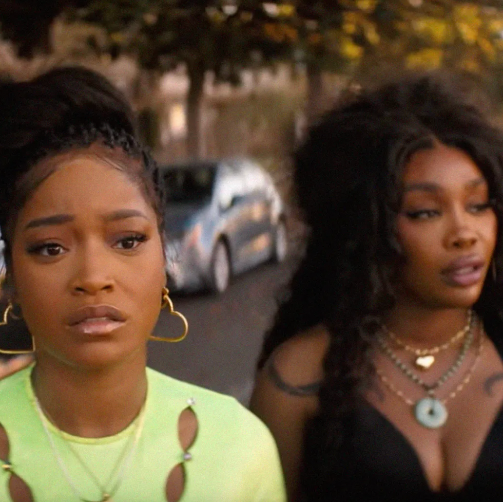 two women walking side by side outdoors featuring distinct fashion styles and accessories two women walking side by side outdoors featuring distinct fashion styles and accessories