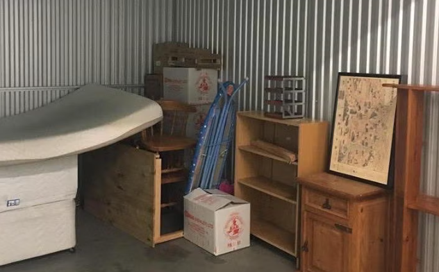 storage unit containing various pieces of furniture and boxes