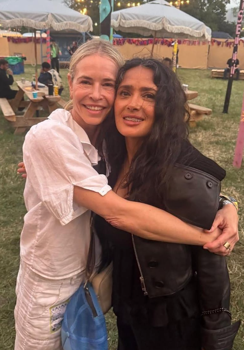 two women embracing at an outdoor event