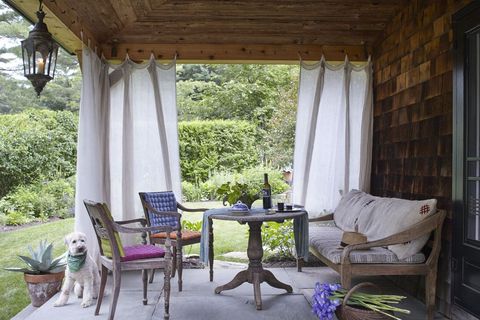 screened porch with white curtain