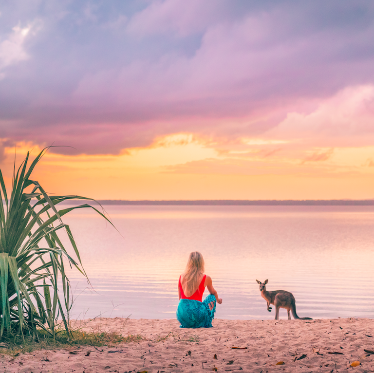woman on beach with kangaroo