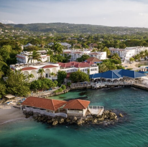 an aerial view of the beach and franklyn d resort and spa, a good housekeeping pick for best all inclusive family resorts