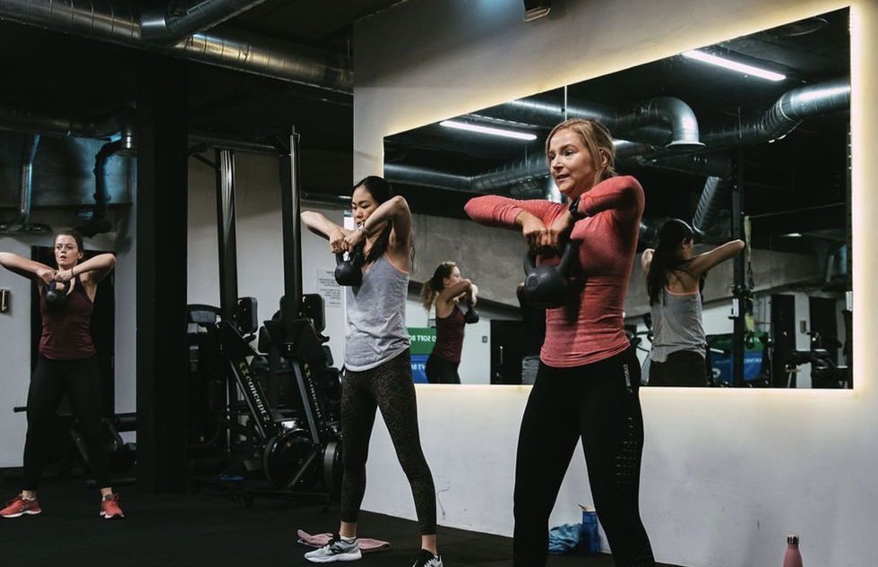 women exercising at gym on