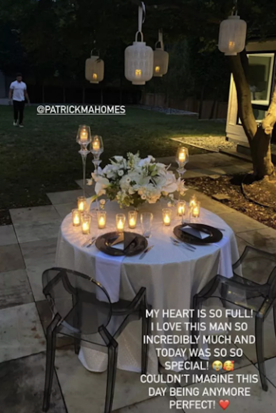 a table with candles and flowers on it