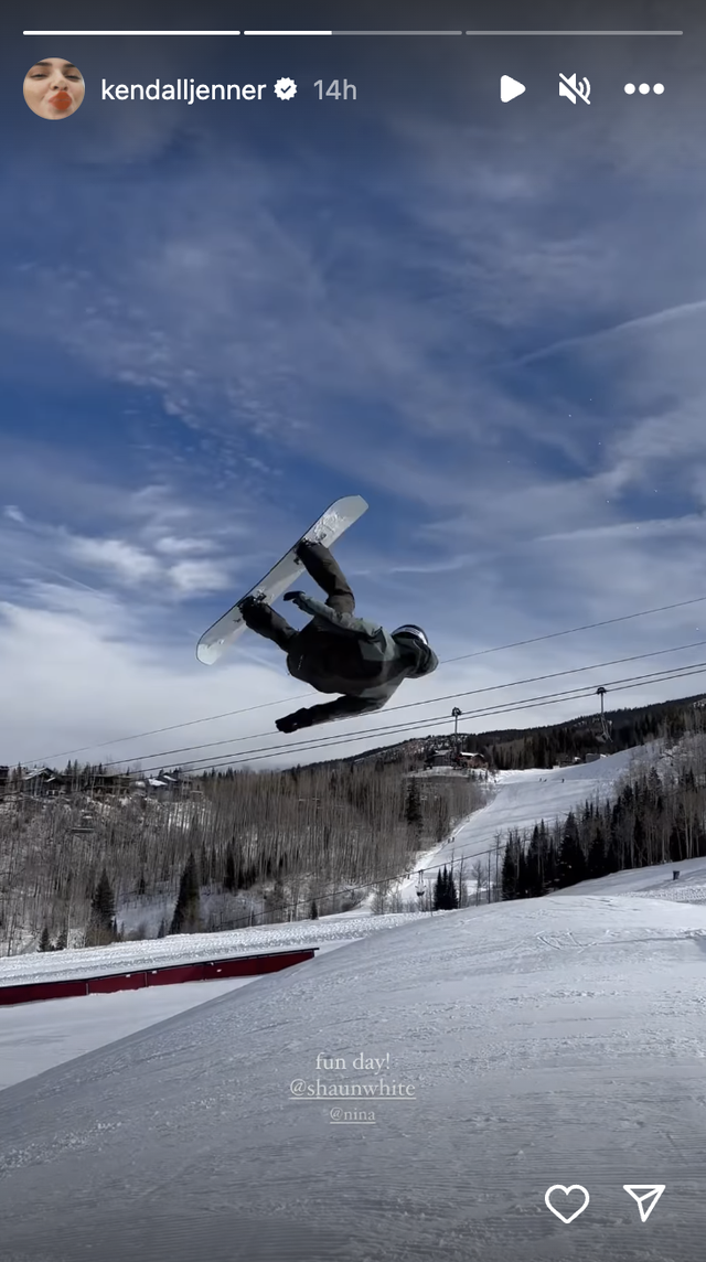 a snowboarder doing a trick in the air