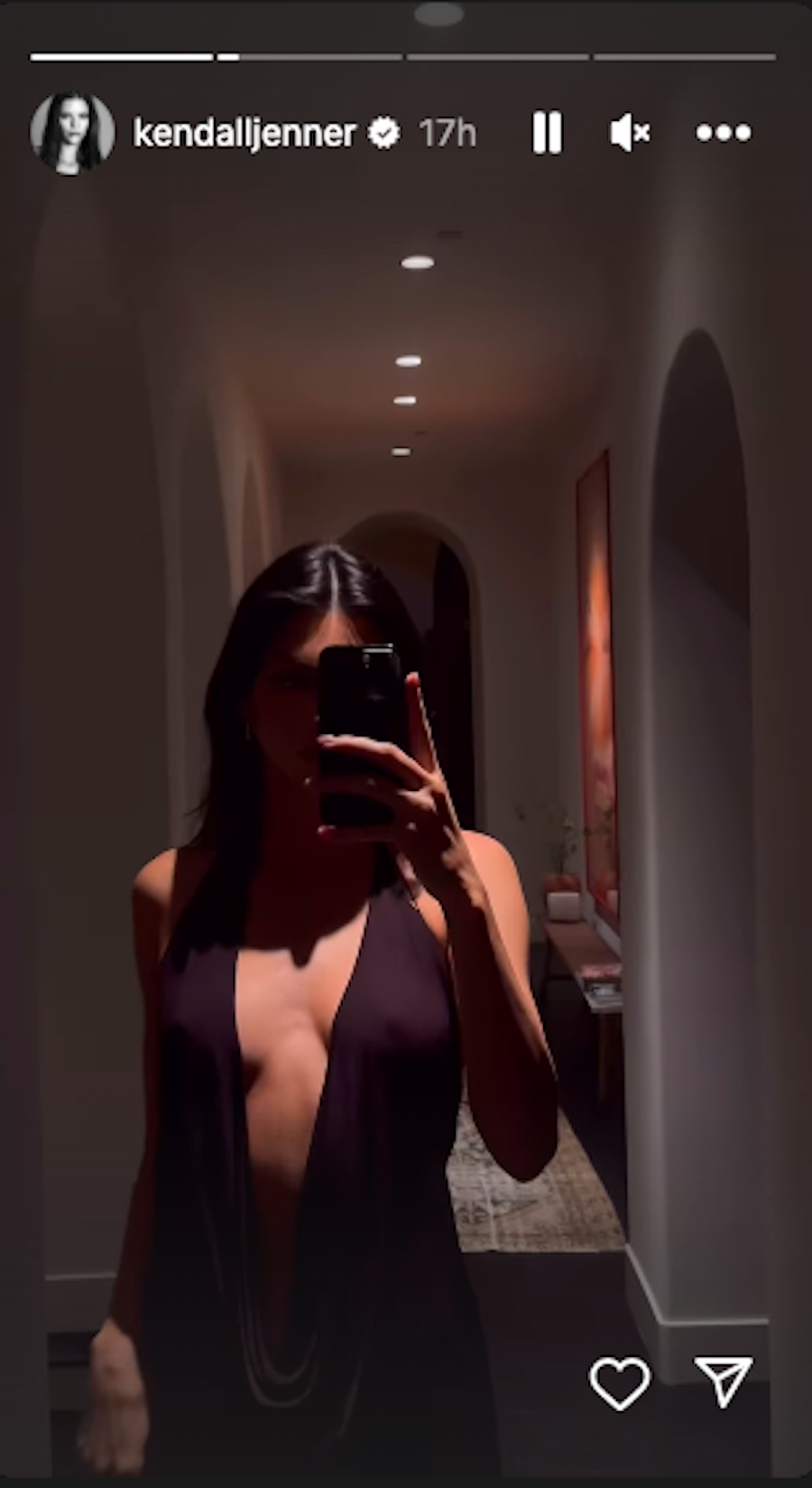 a woman taking a selfie in a mirror